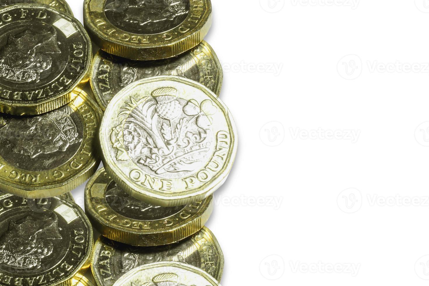 British currency the new one pounds coins isolate on white background. photo