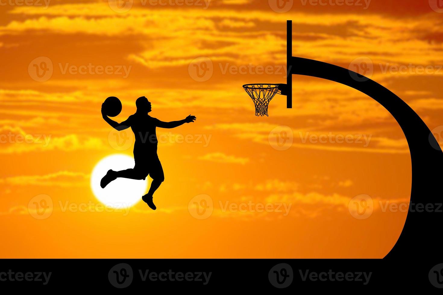 basketball player silhouette jumping photo