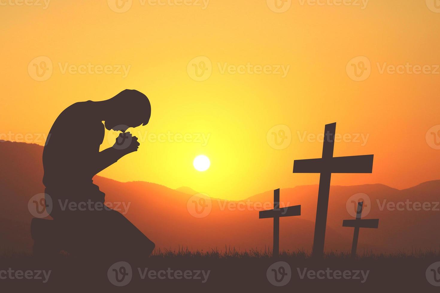 Silhouette of Christian Praying Hands Spiritual and Religious People Praying to God Christianity Concepts. End war and violence photo