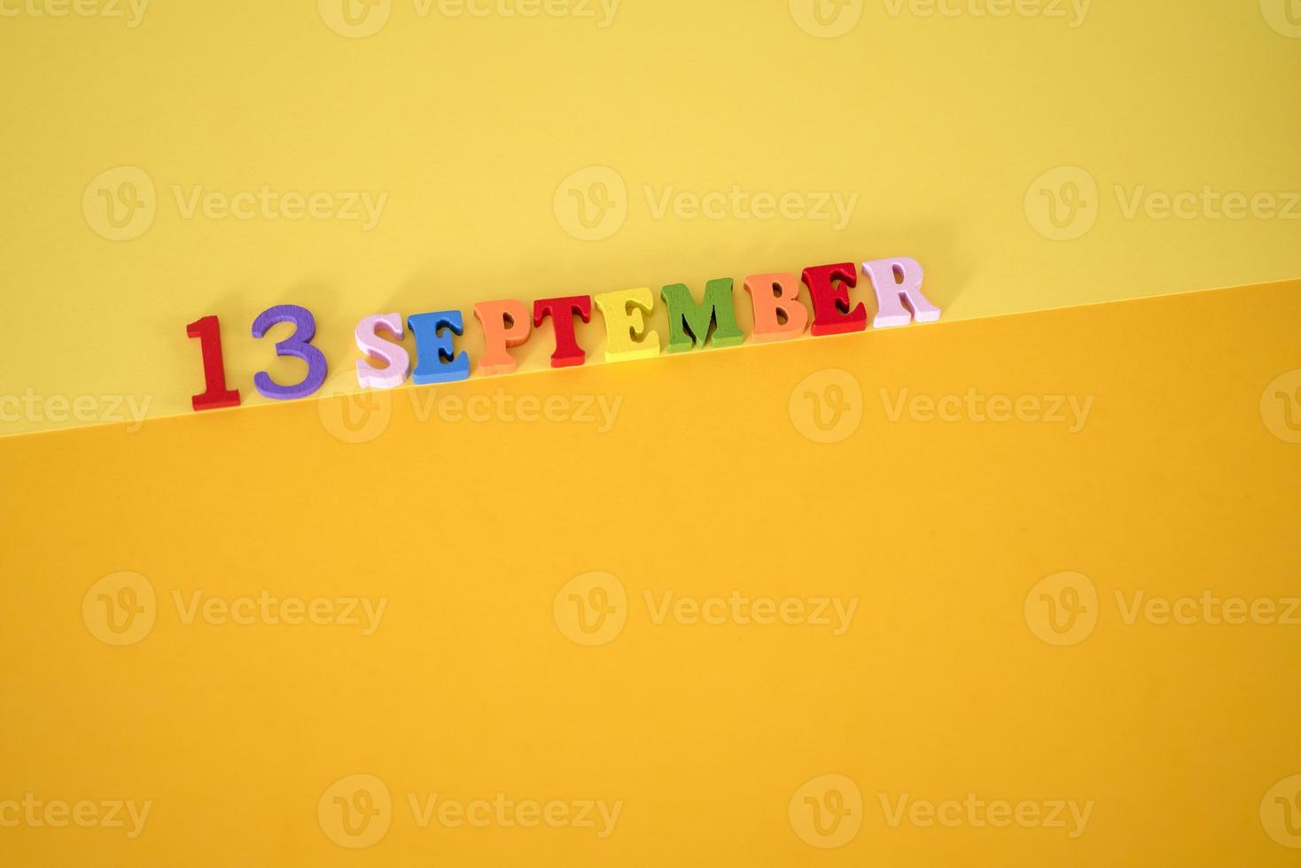 September 13 on a yellow background with room for text. photo