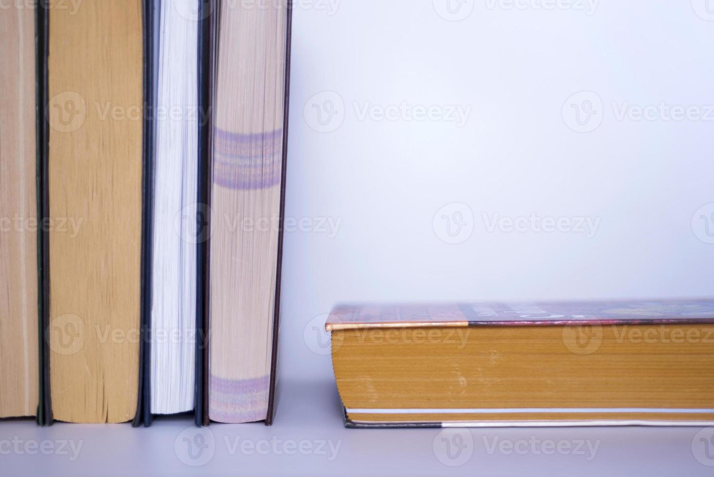 Books on a gray table in a bookstore on a gray background. photo