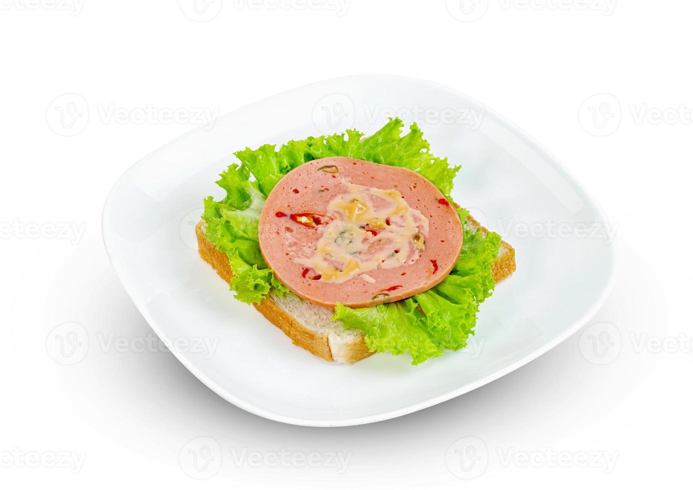 bologna sliced with bread and lettuce leaf isolated on white background photo