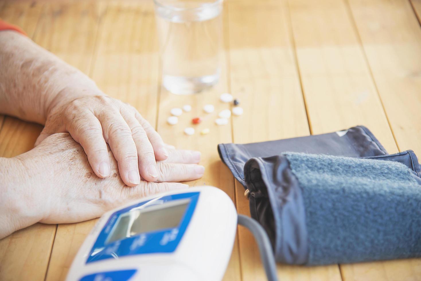 Old lady is being checked blood pressure using blood pressure monitor kid set - people with health care medical instrument set concept photo