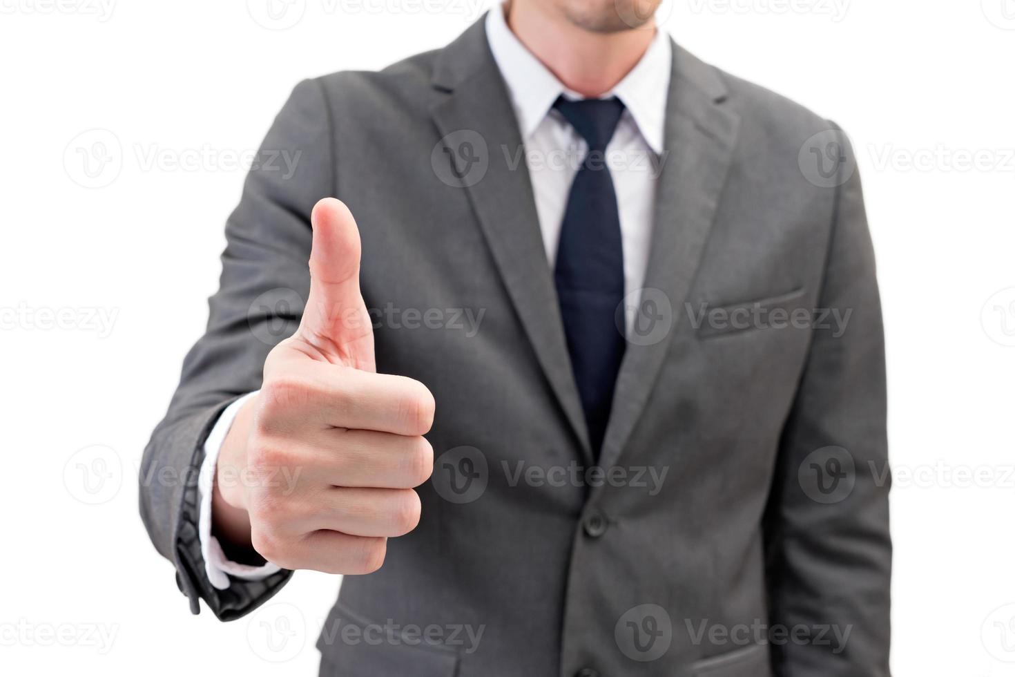 Businessman showing thumbs up isolated on white background. photo