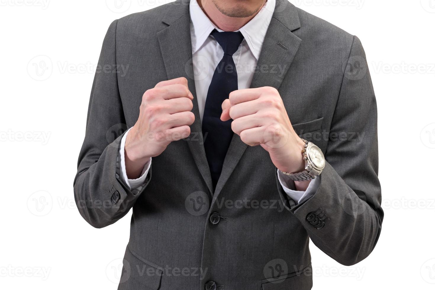 businessman holding his fists in front of him isolated on white background. business struggle photo