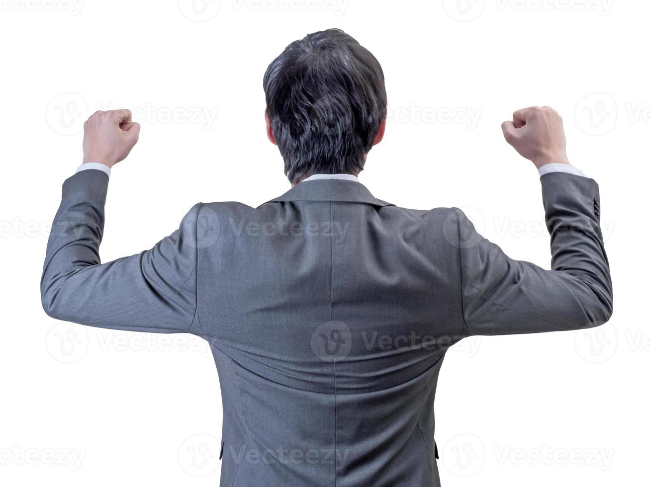 backview of businessman standing with hands up. photo