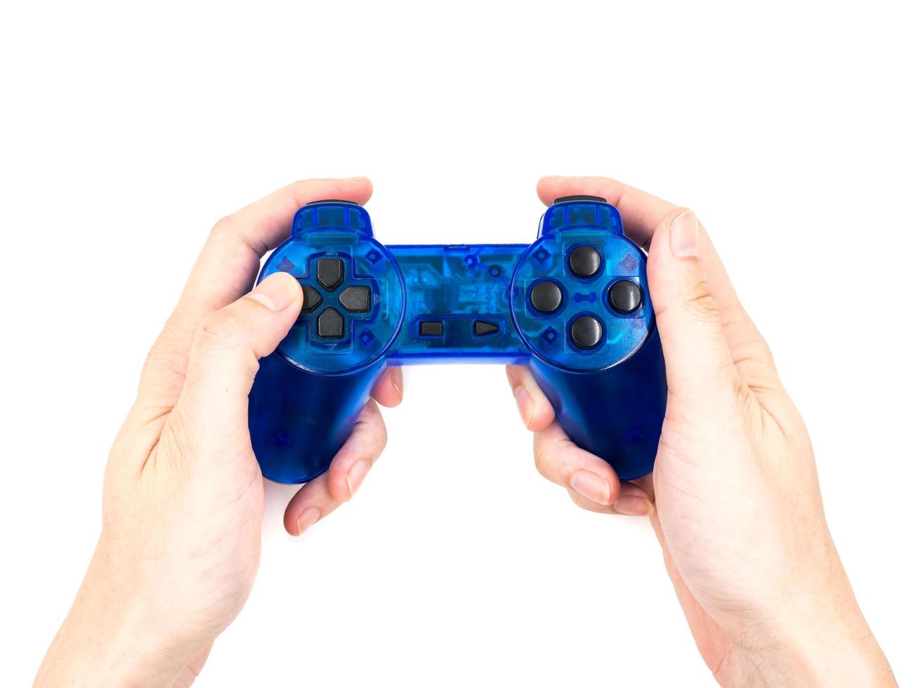 Hand holding video game controller on white background photo