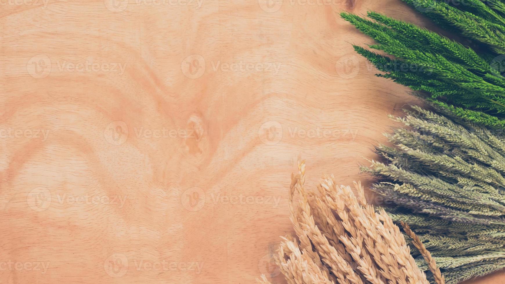 Top view of whet crop on wooden table background. photo