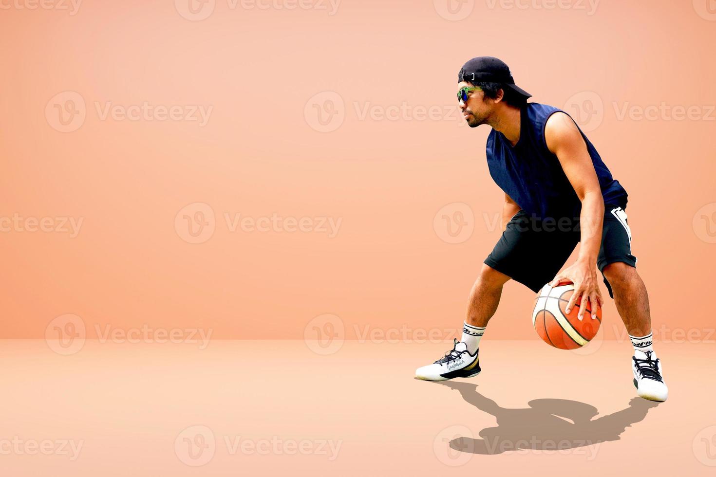 Asian basketball player on colored background photo