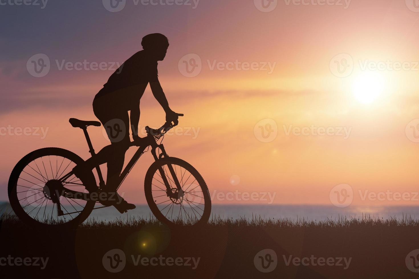 Silhouettes of mountain bikes and cyclists in the evening happily. Travel and fitness concept.  Silhouette of cyclists touring in the evening bicycle touring concept photo