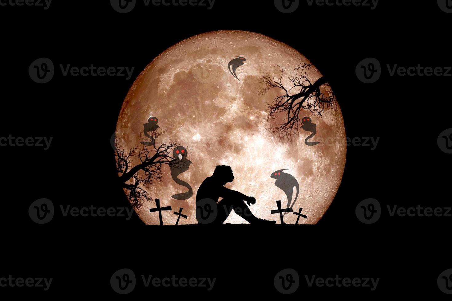 Halloween festival idea. Ghost of a dead tree with the moon in the background. photo