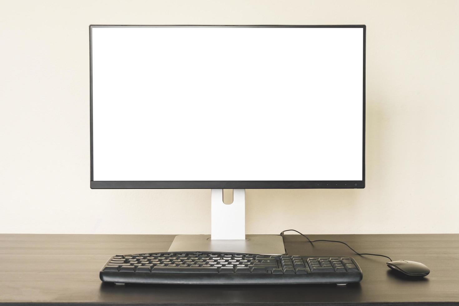 Computer with white screen on the desk. photo