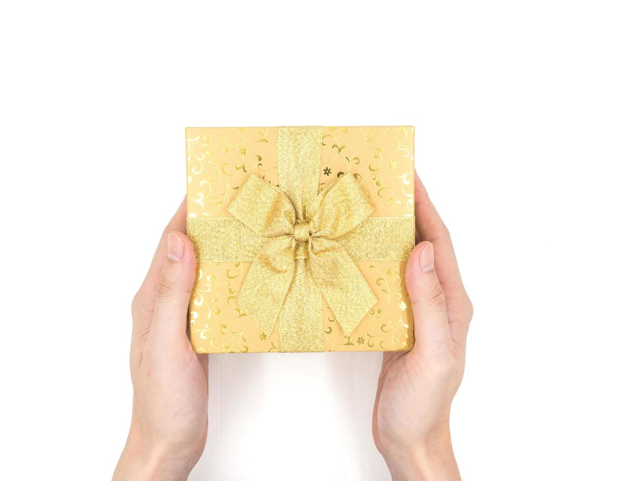 Hands holding Gift box on white background photo