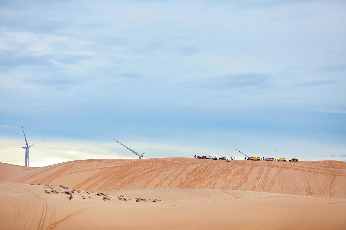 A beautiful landscape, raw of blue sky in desert, beautiful landscape of white sand dunes  the popular tourist attraction place in Mui Ne, Vietnam. photo