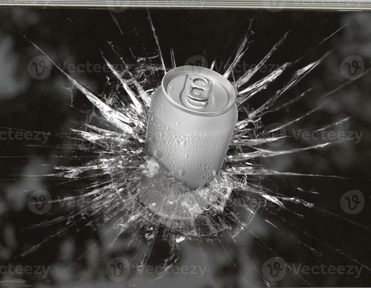 Aluminum cans burst through broken glass photo