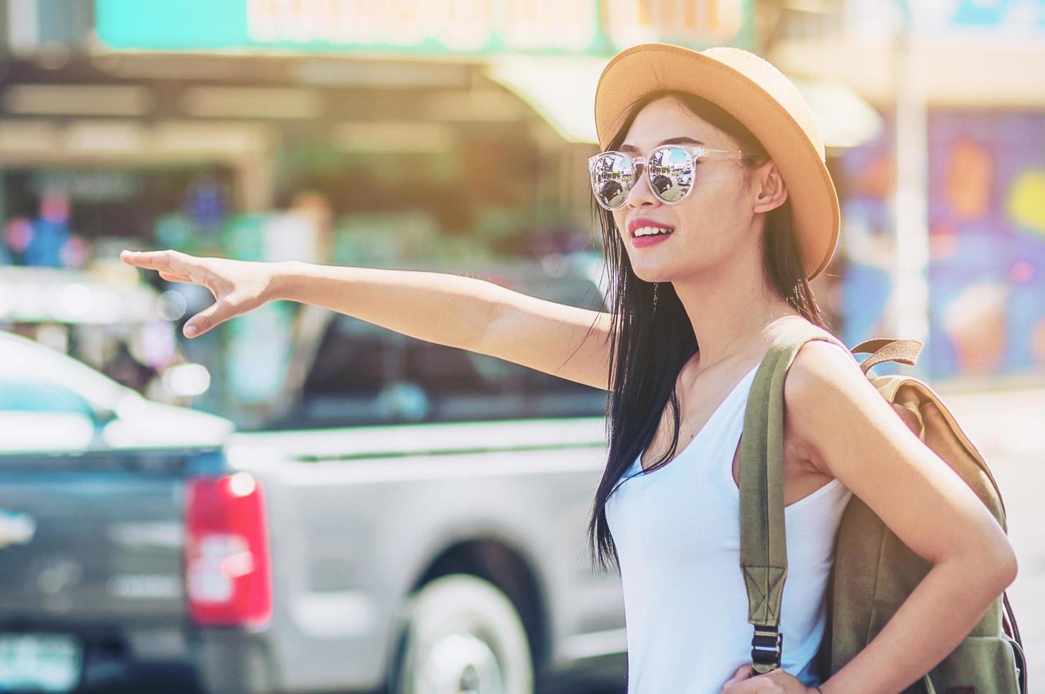 Tourist travel woman looking at the map while walking at train station  - street backpack travel concept photo