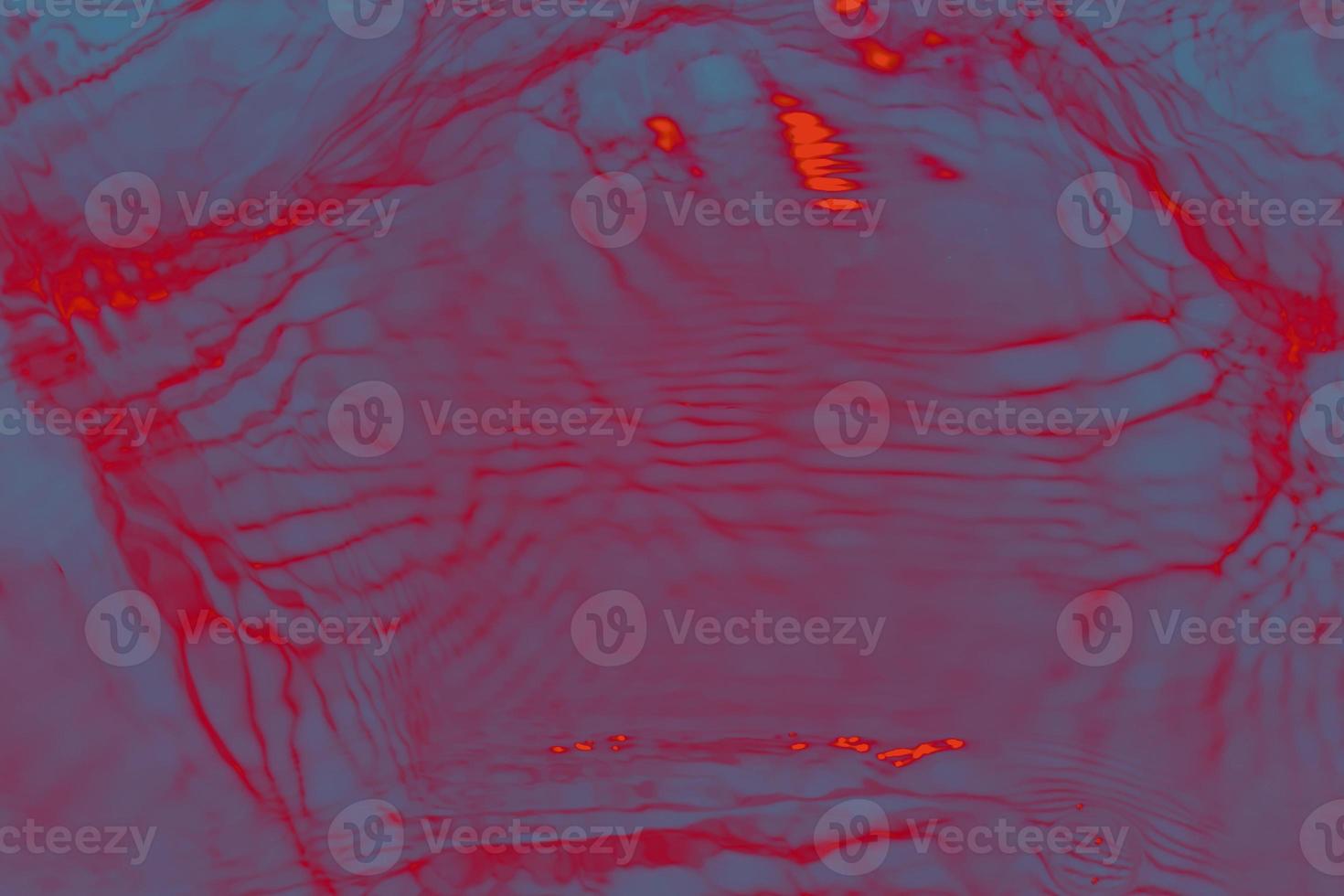 Defocus blurred transparent blue colored clear calm water surface texture with splashes and bubble. Trendy abstract nature background. Water wave in sunlight with copy space. Blue watercolor texture photo