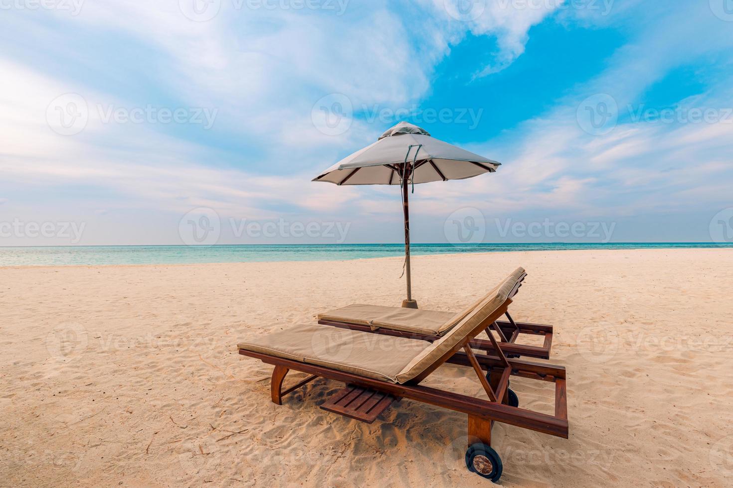 Beautiful beach. Chairs on the sandy beach near the sea. Summer holiday and vacation concept for tourism. Inspirational tropical landscape photo