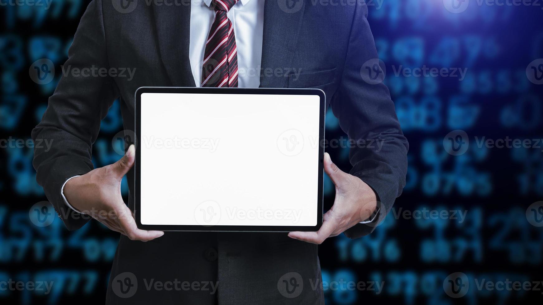 Business man holding and shows touch screen tablet with digital device, technology photo