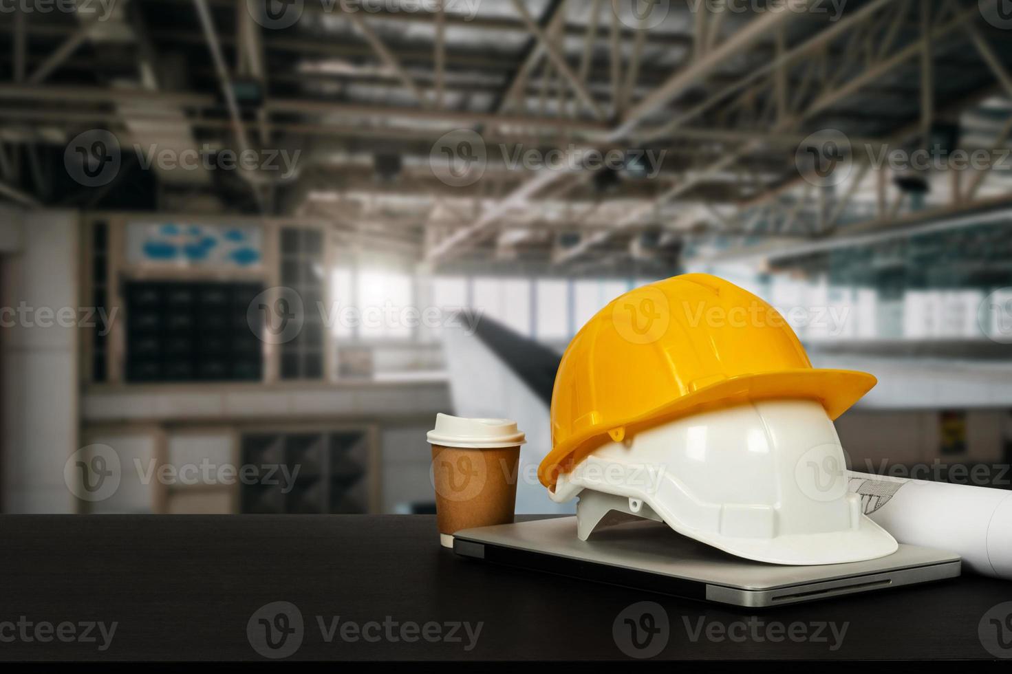 Construction house and building. Repair work. Dof laptop computer and office construction on table in office Architect concept. photo