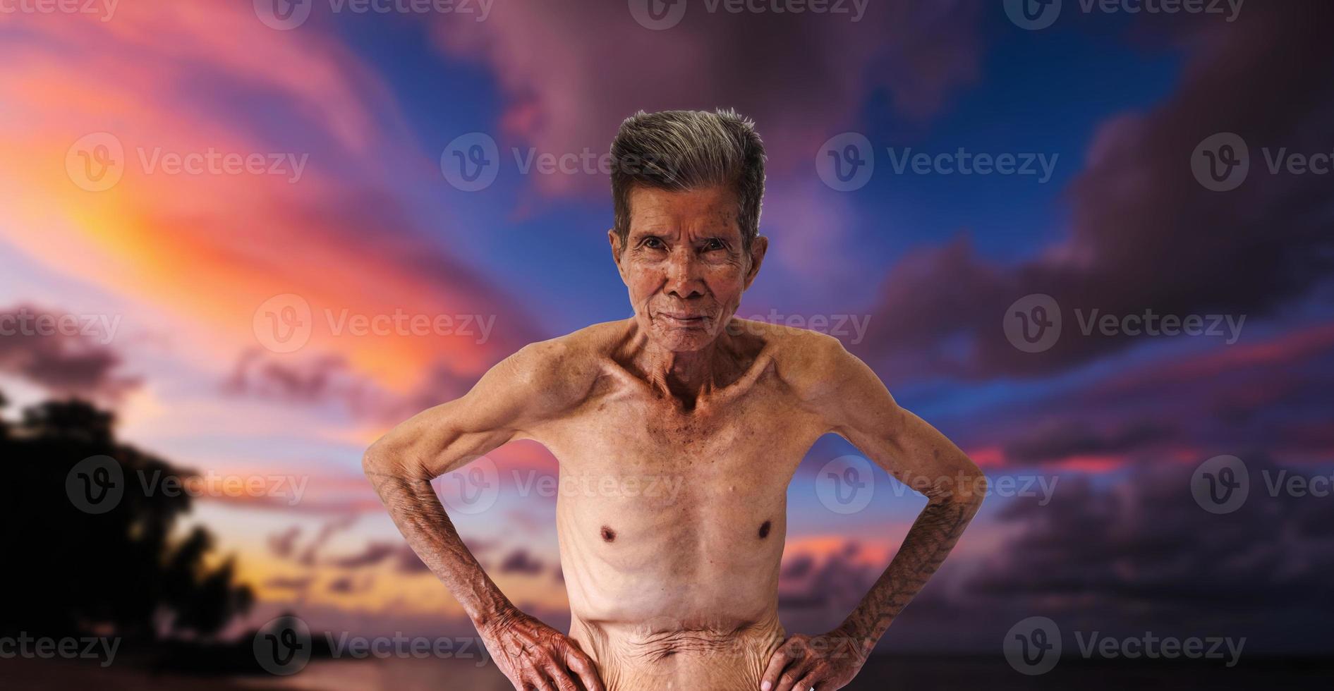 Asian happy old man Skinny torso in a sea photo