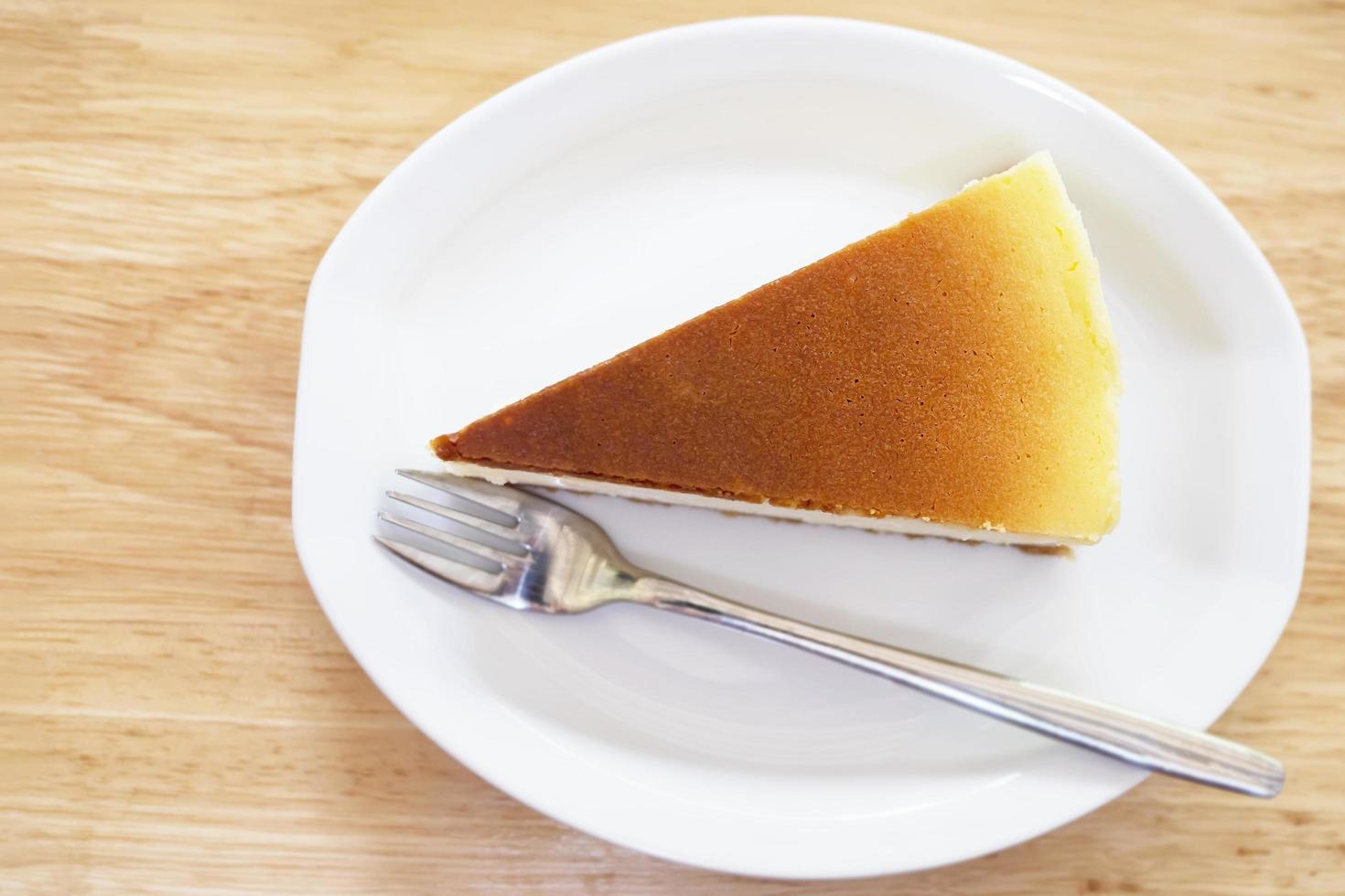 New York cheesecake on white wooden table - homemade cooking bakery concept photo