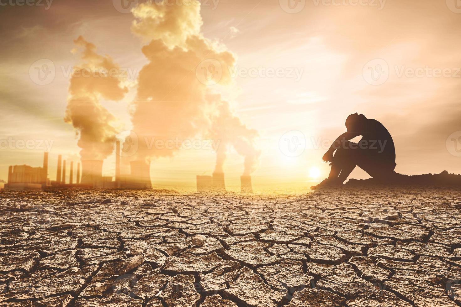 concept of global warming and drought People sat mourning over the drought. A world without water and food shortages. water and food crisis photo