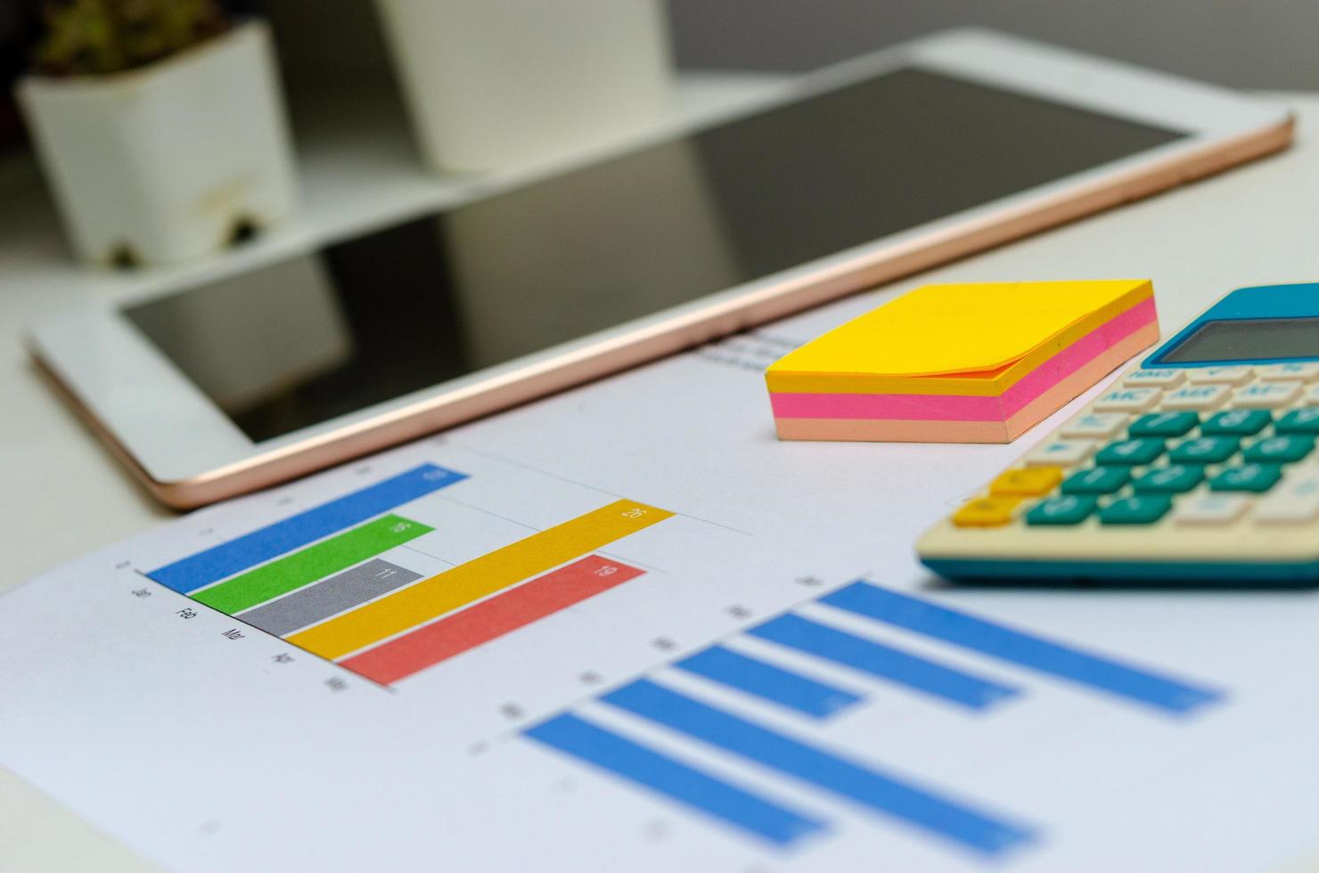 Business document chart and graph analysis finance information investment report on desk at office. photo