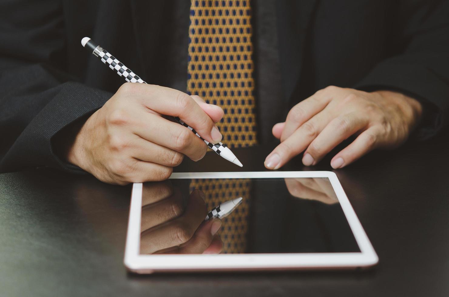 Business man sign digital online tablet contract in application on desk. photo