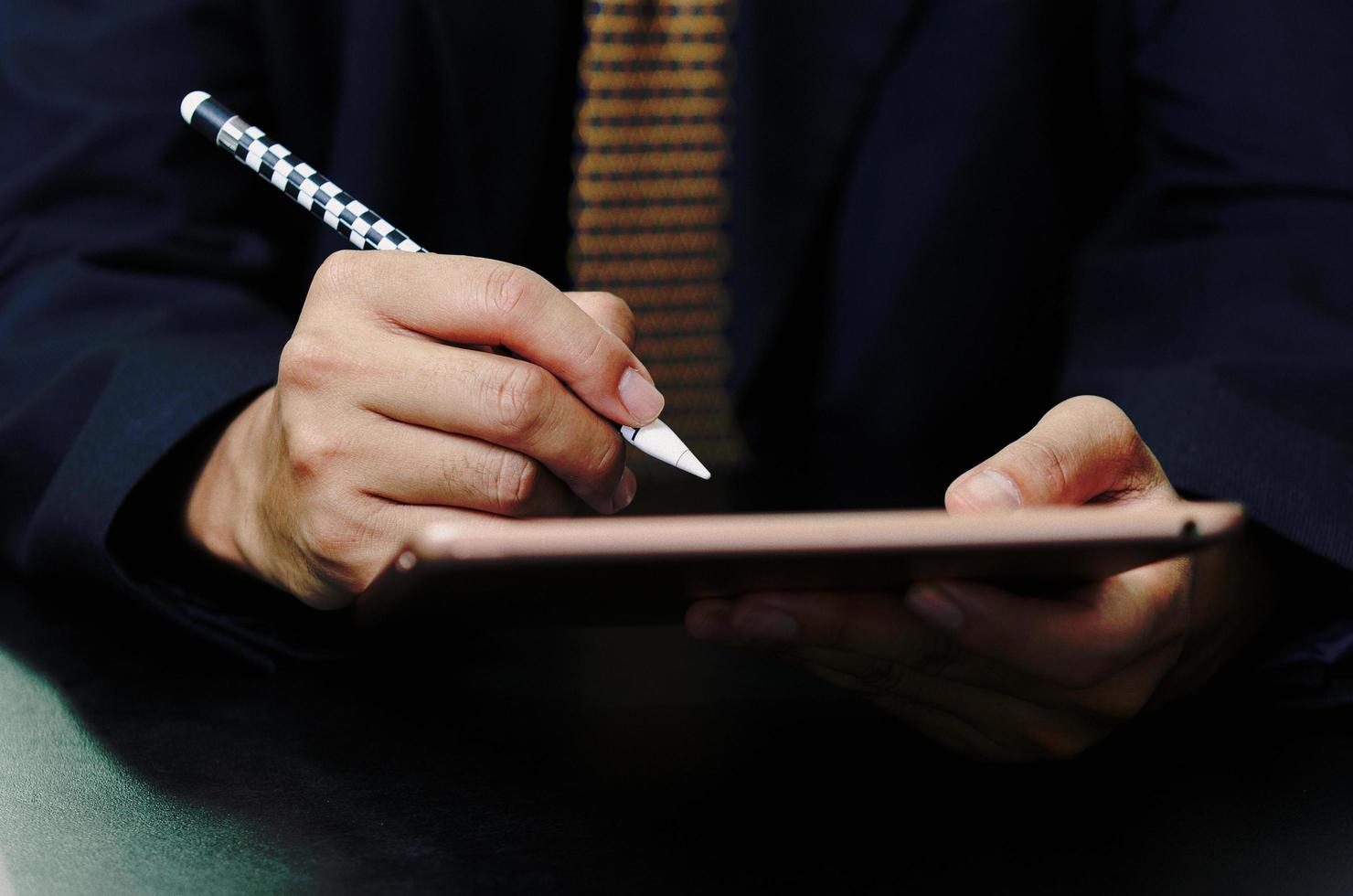 Business man sign digital online tablet contract in application on desk. photo