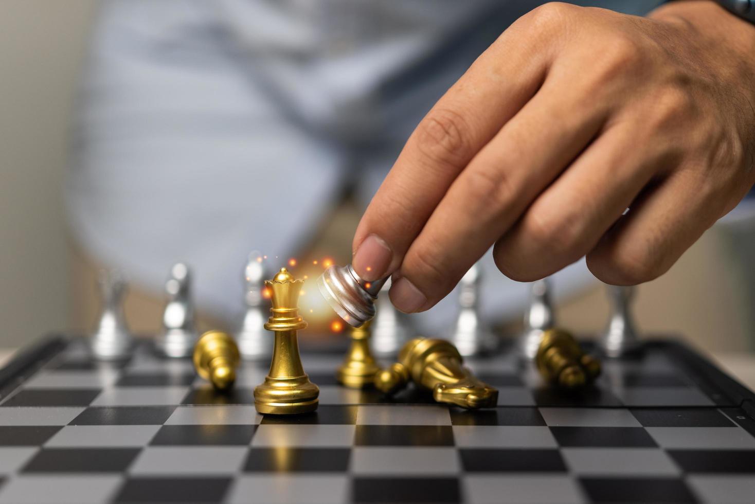 Hand man holding chess in game.Idea planning strategy marketing business concept. photo