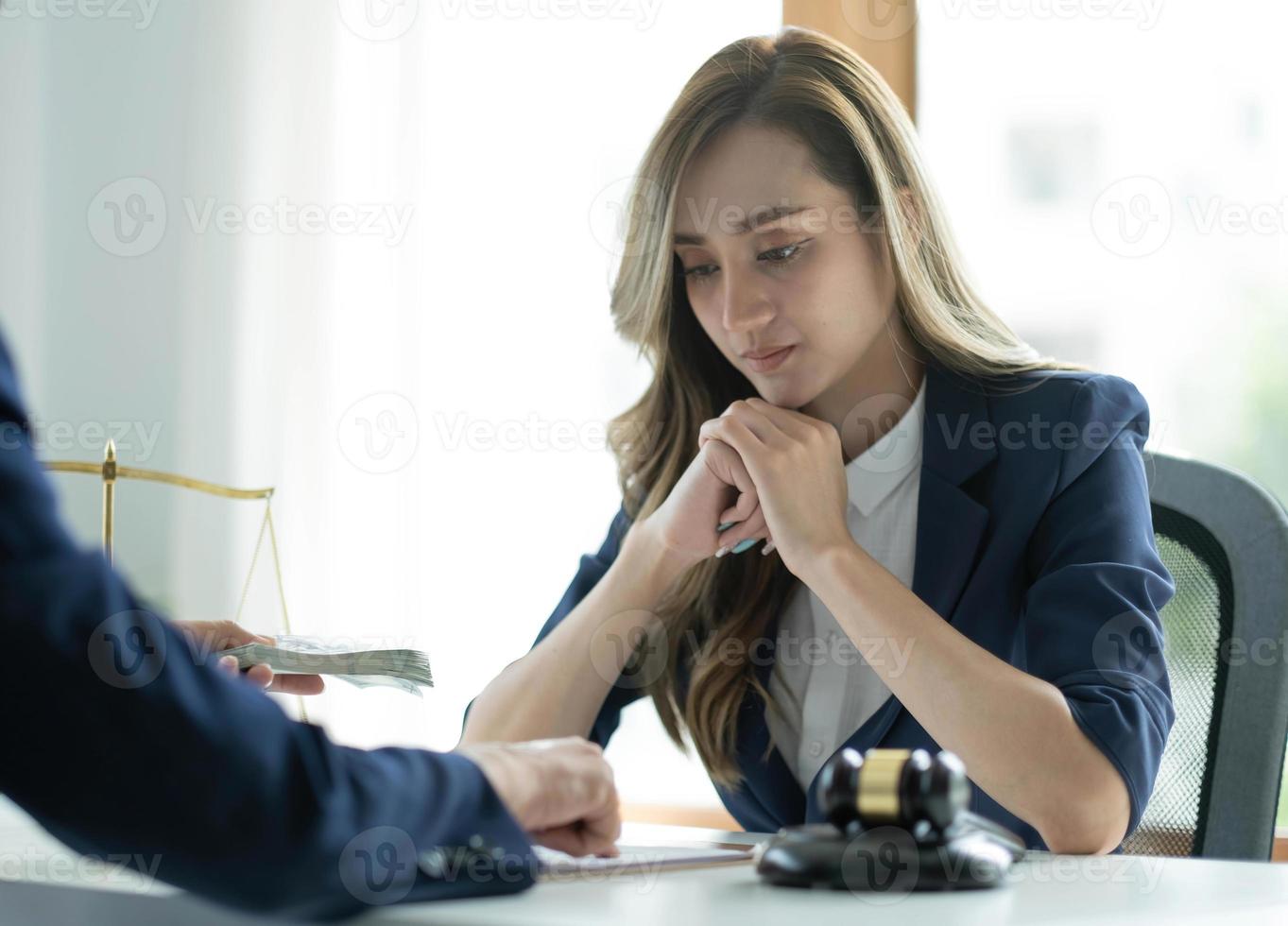 A professional asian female lawyer or business legal consultant having a secret meeting with her client and receives a bribe. cropped shot photo