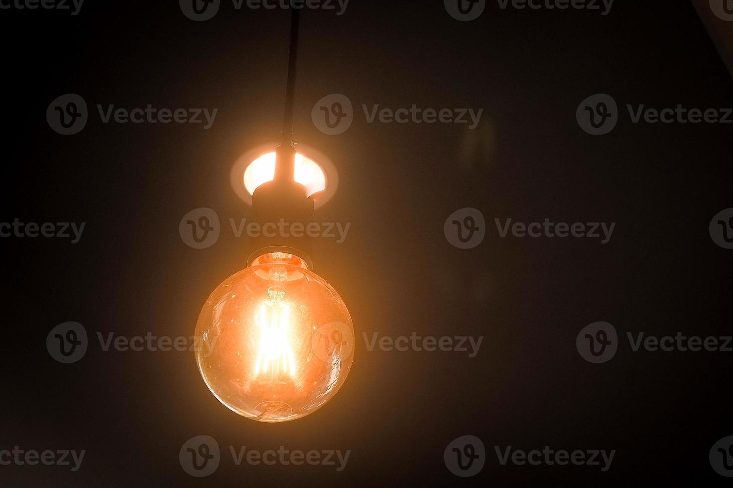 orange light bulbs in a restaurant photo