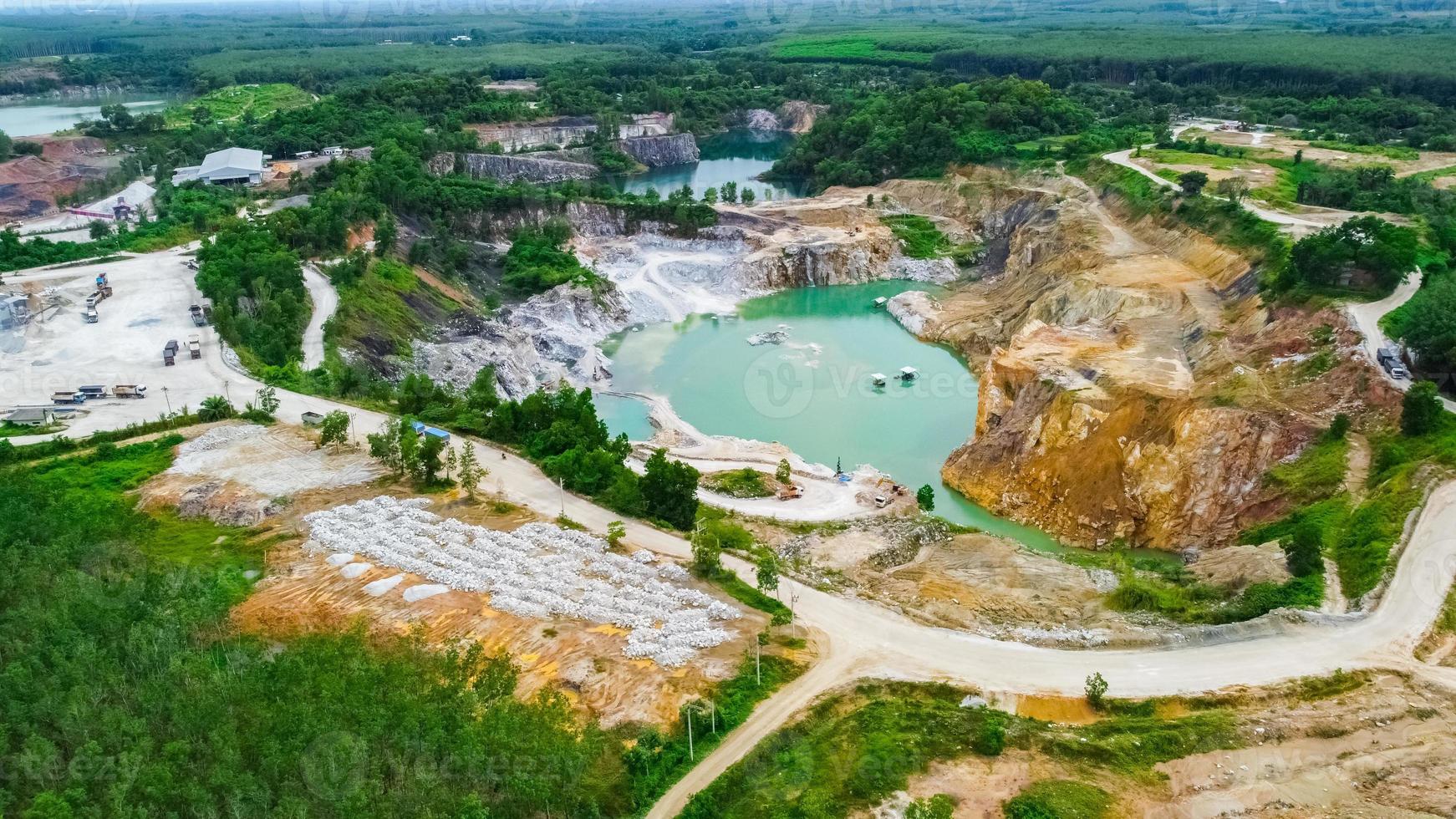 aerial photograph of a large pit of a gypsum mine. A large gypsum mine. Mining and Geology Industry Concepts photo