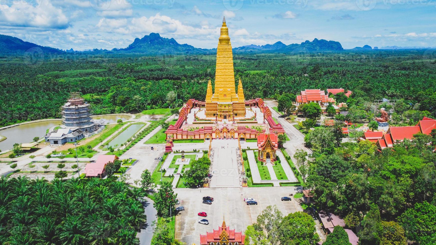 An aerial view of a large temple in Thailand that is beautiful and is a very popular tourist destination. Wat Bang Tong, Krabi Province, Thailand photo