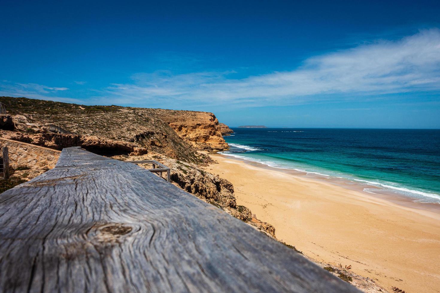 View of beach from timber decking photo