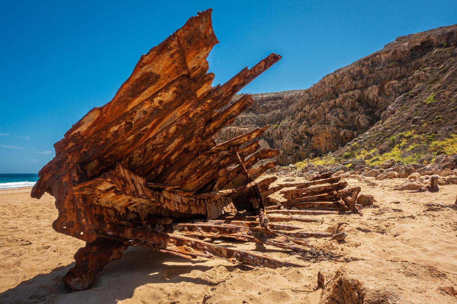 Ship wreck on beach photo