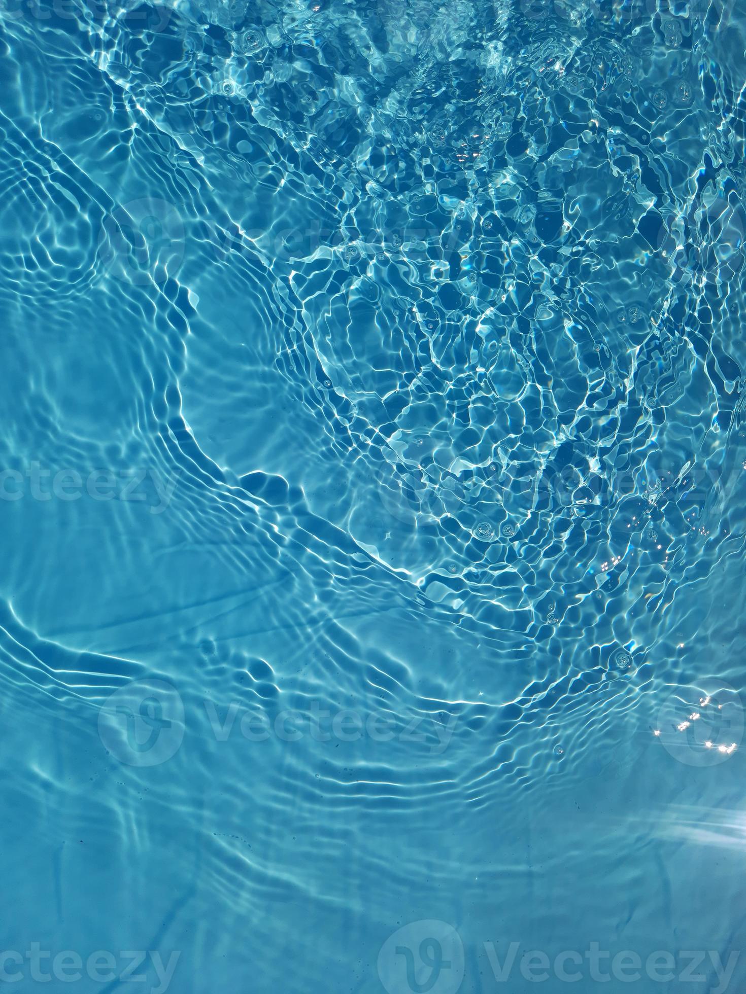 Defocus blurred blue water shining in the sea. rippled water ...