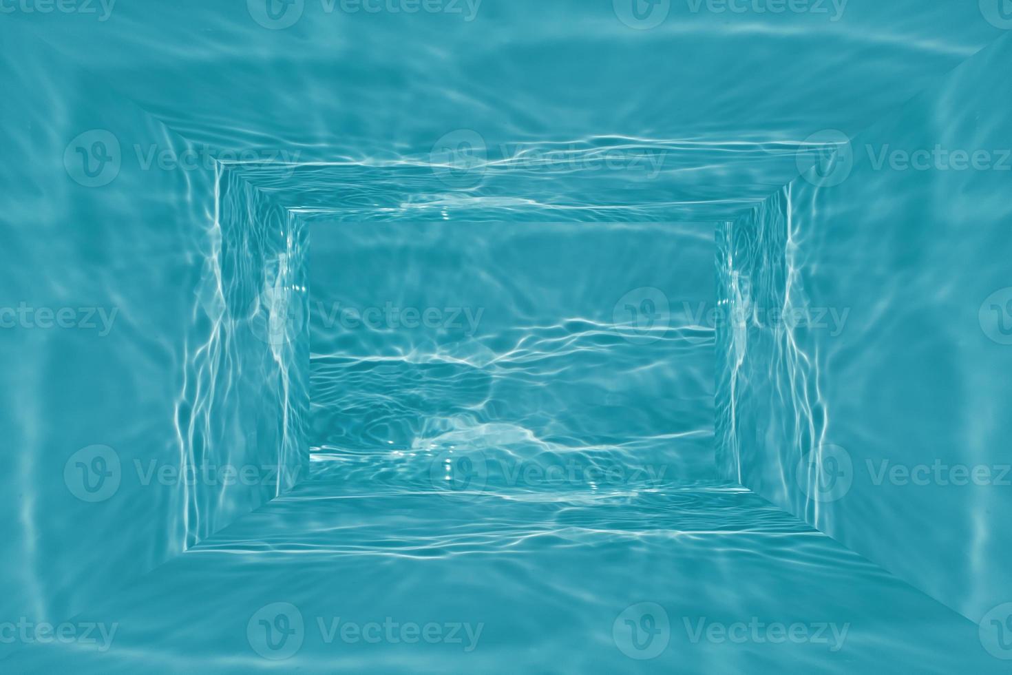 Defocus blurred transparent blue colored clear calm water surface texture with splashes and bubble. Trendy abstract nature background. Water wave in sunlight with copy space. Blue watercolor texture photo