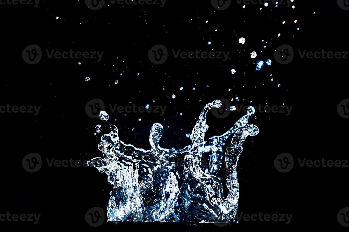 Abstract background of Water splashing on a black background. idea for freshness photo