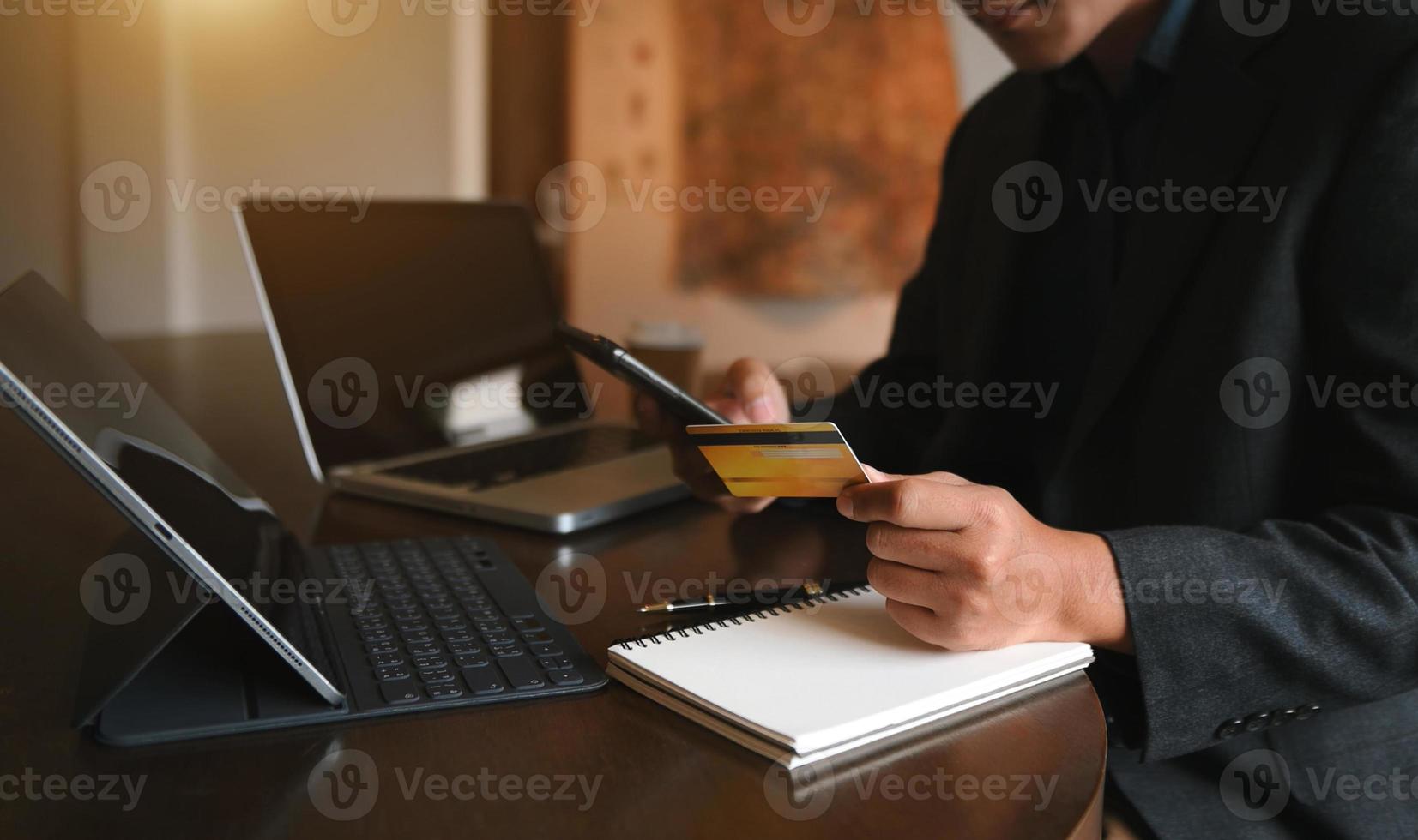 Manhands using smartphone and holding credit card with digital layer effect diagram as Online shopping concept photo