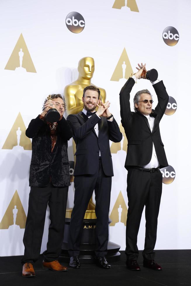 LOS ANGELES, FEB 28 - Mark Mangini, Chris Evans, David White at the 88th Annual Academy Awards, Press Room at the Dolby Theater on February 28, 2016 in Los Angeles, CA photo