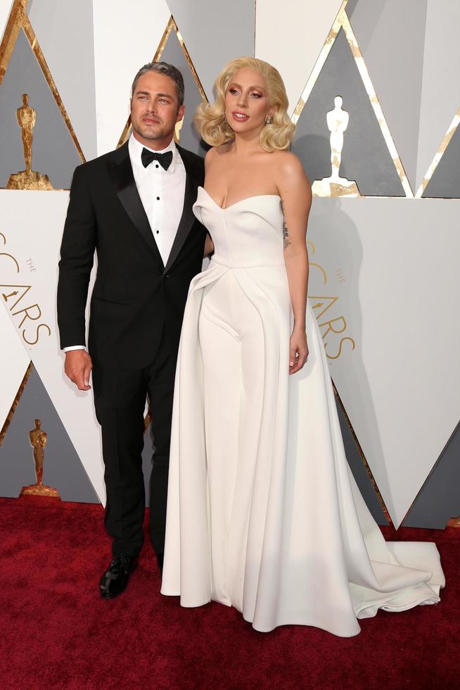 LOS ANGELES, FEB 28 - Taylor Kinney, Lady Gaga at the 88th Annual Academy Awards, Arrivals at the Dolby Theater on February 28, 2016 in Los Angeles, CA photo