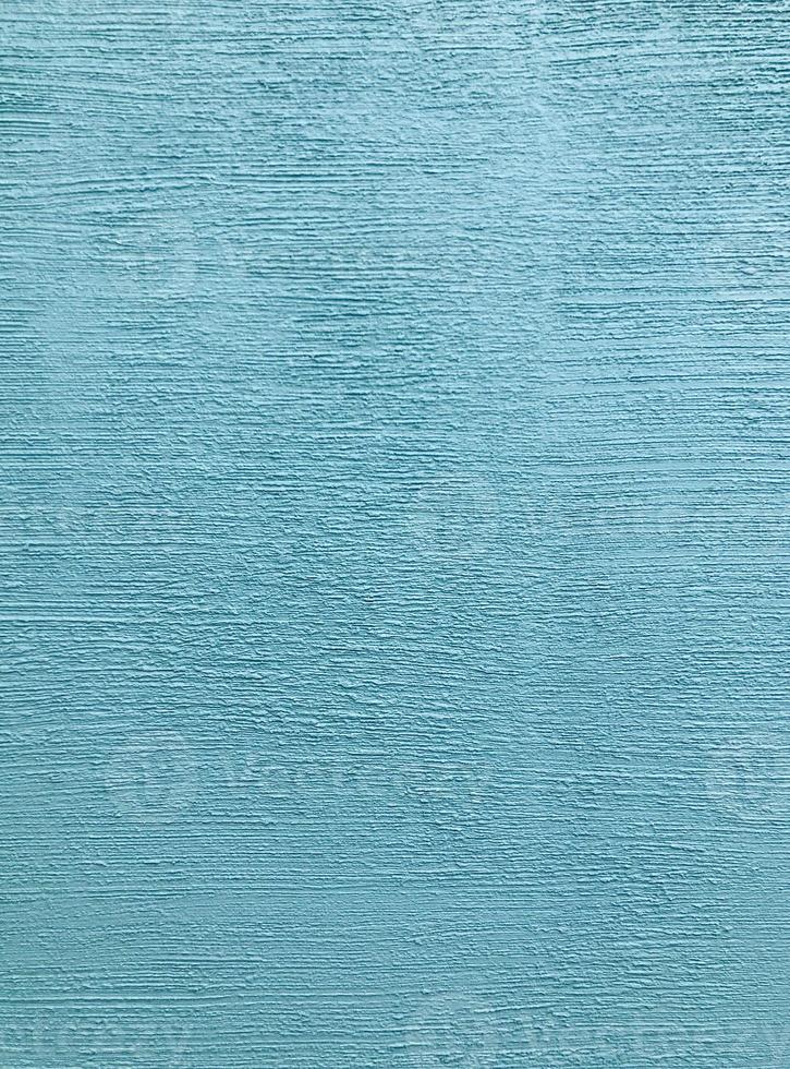 Blue aqua stone grain linear pattern wall spray painted texture concrete background in retro style with copy space photo