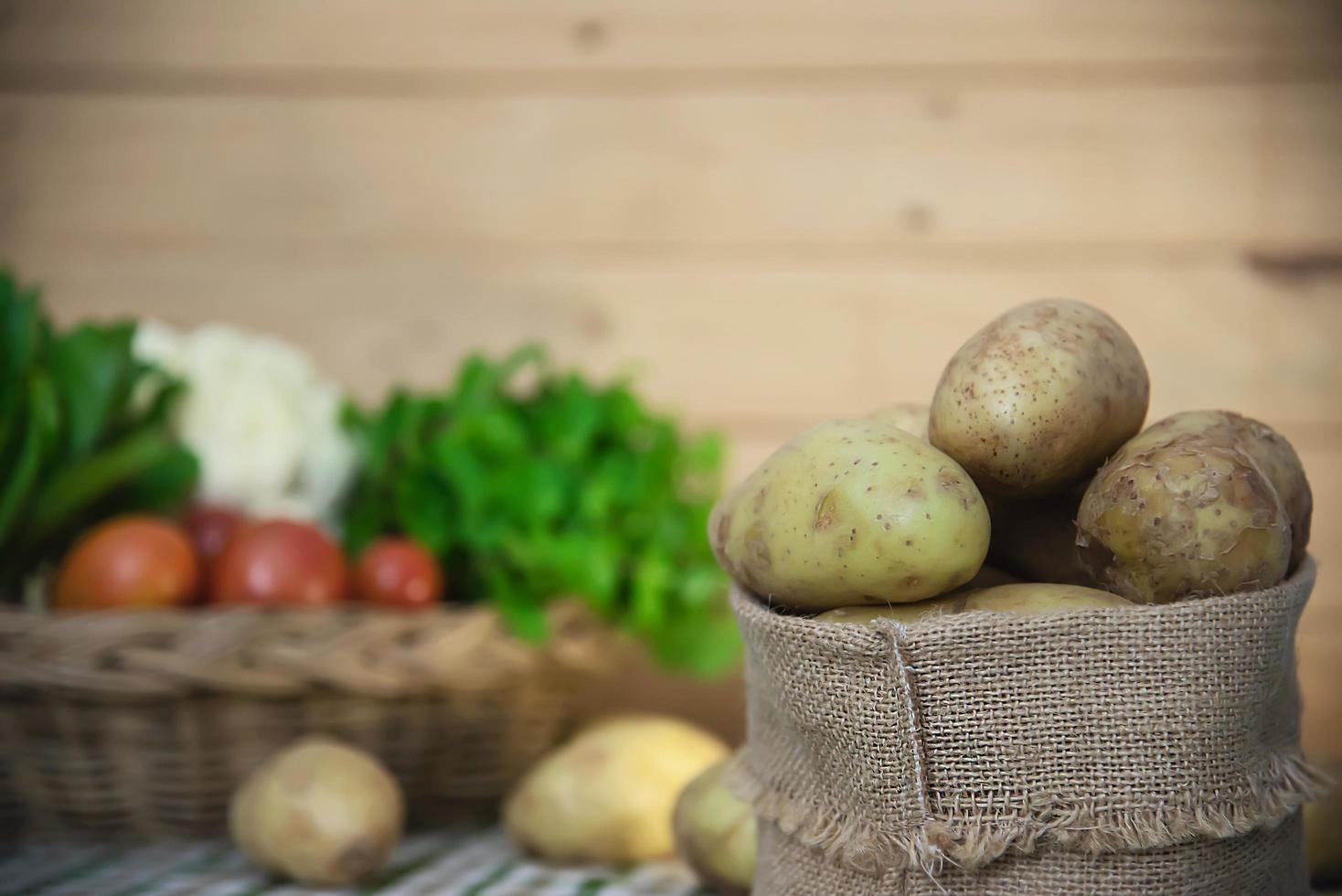 Fresh potato in kitchen ready to be cooked - fresh vegetable preparing for making food concept photo