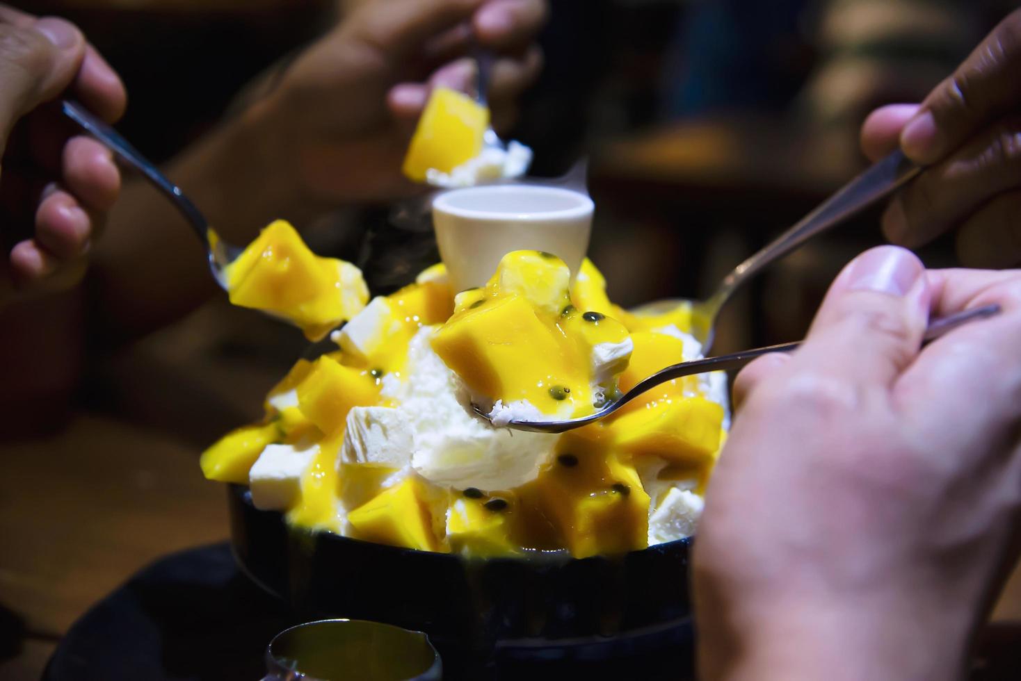 People eating bingsu sweet dessert - people with Korean style sweet dessert for background use photo