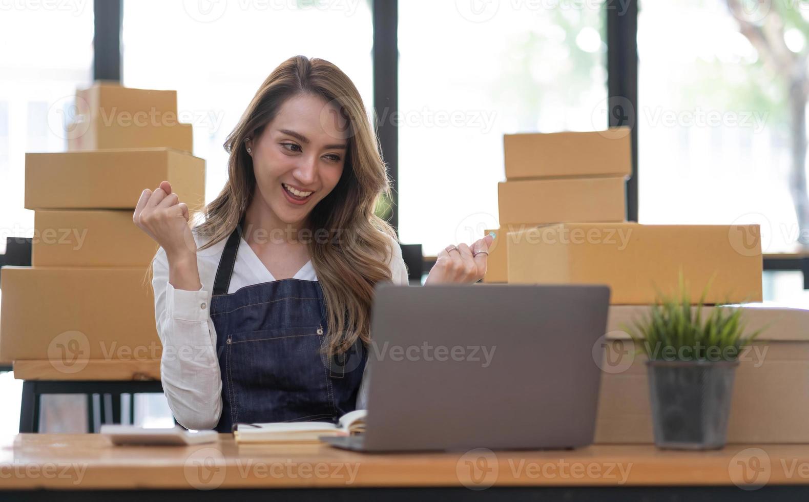 Portrait of Starting small businesses SME owners female entrepreneurs working on receipt box and check online orders to prepare to pack the boxes, sell to customers, SME business ideas online. photo