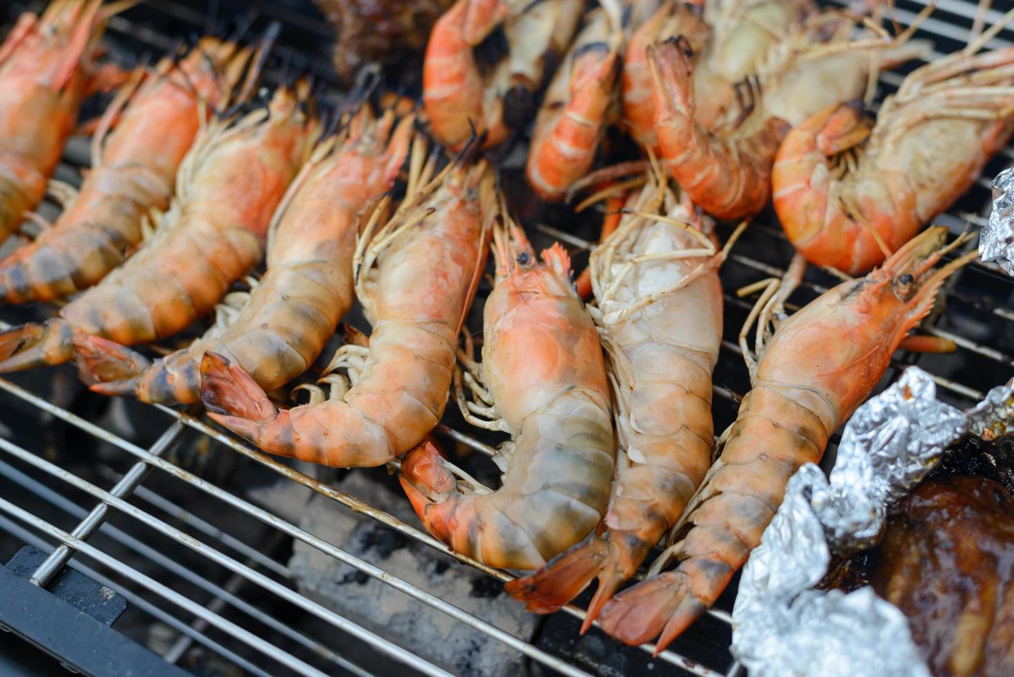 shrimps grilled on the charcoal stove, bbq seafood photo