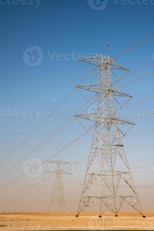 Giant electricity cables in the desert photo