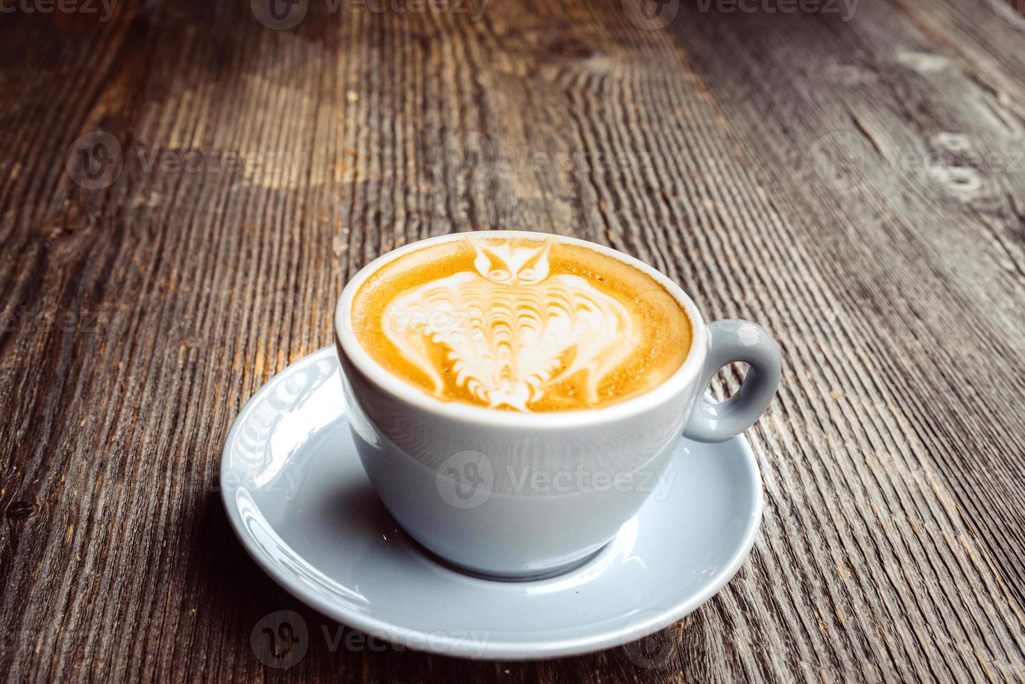 top view of cappuccino coffee dress up, in white cup photo